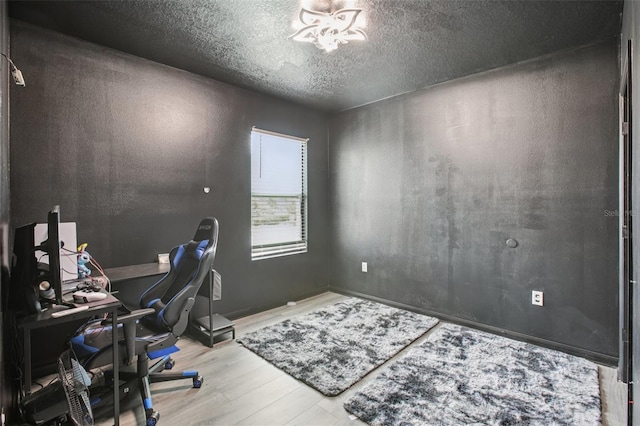 10233 Opaline Sky Pl, Riverview, FL 33578 - office space with wood finished floors, a textured ceiling, and a chandelier