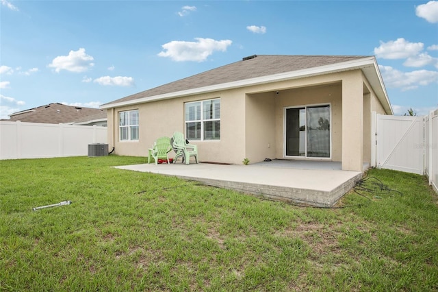10233 Opaline Sky Pl, Riverview, FL 33578 - rear view of house with a patio, stucco siding, central AC unit, and a gate