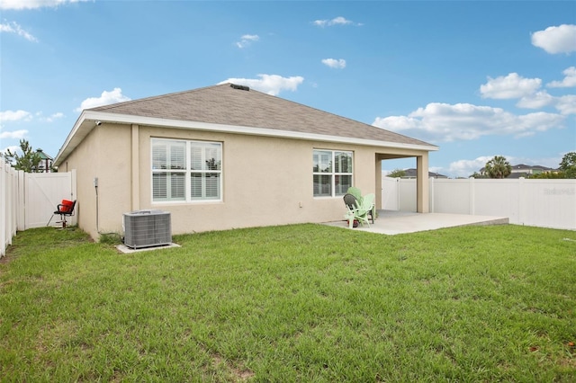 10233 Opaline Sky Pl, Riverview, FL 33578 - back of house featuring central air condition unit, a patio area, stucco siding, and roof with shingles