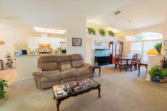 2826 Martha Ln, Land O Lakes, FL 34639 - living area with light carpet, a chandelier, and high vaulted ceiling