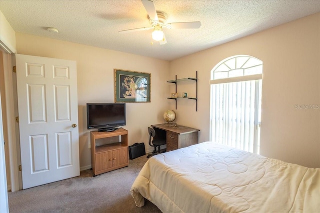 2826 Martha Ln, Land O Lakes, FL 34639 - bedroom with light carpet, a textured ceiling, and a ceiling fan