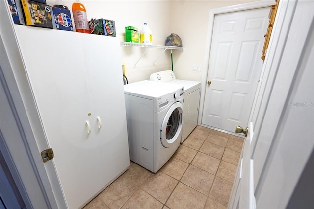 2826 Martha Ln, Land O Lakes, FL 34639 - washroom with washing machine and clothes dryer and light tile patterned flooring