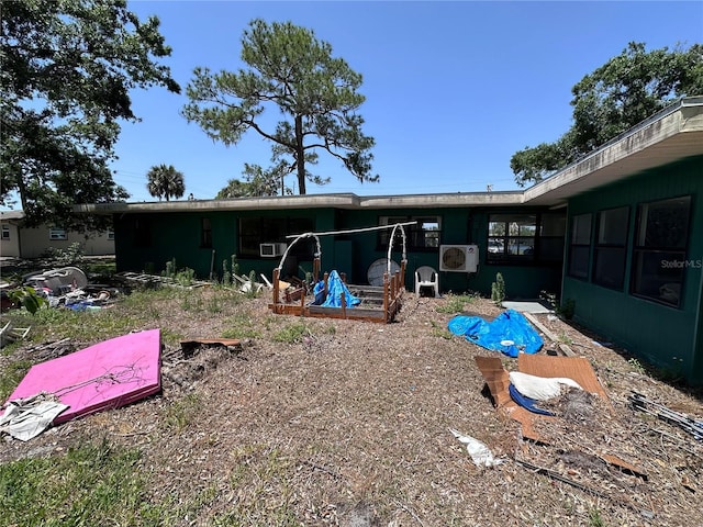 314 Dickman Dr SW, Ruskin, FL 33570 - back of house featuring a cooling unit