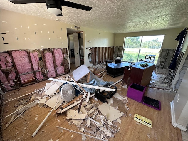 314 Dickman Dr SW, Ruskin, FL 33570 - miscellaneous room featuring wood finished floors, a textured ceiling, and a ceiling fan