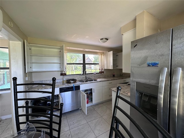 314 Dickman Dr SW, Ruskin, FL 33570 - kitchen with stainless steel appliances, a sink, white cabinetry, and open shelves