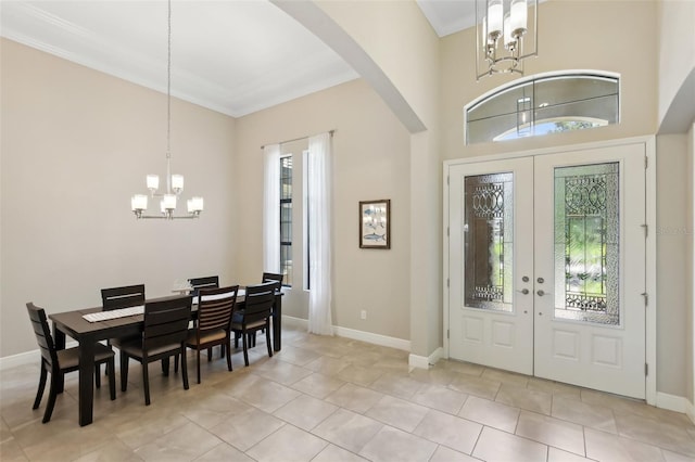 14715 Fishhawk Preserve Dr, Lithia, FL 33547 - entrance foyer with a chandelier, arched walkways, healthy amount of natural light, french doors, and ornamental molding