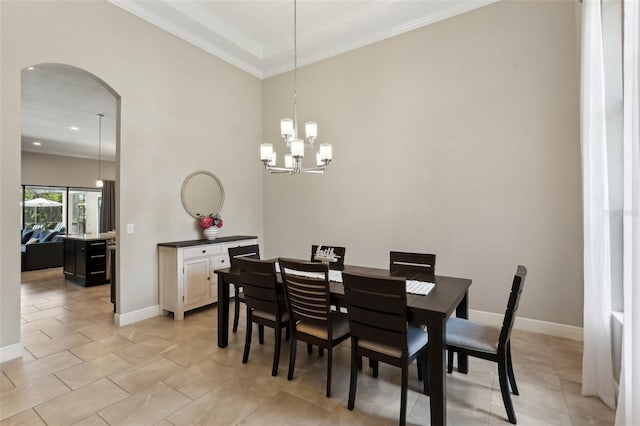 14715 Fishhawk Preserve Dr, Lithia, FL 33547 - dining space featuring arched walkways, a chandelier, crown molding, baseboards, and light tile patterned floors