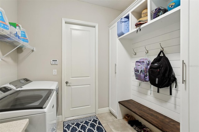 14715 Fishhawk Preserve Dr, Lithia, FL 33547 - laundry room featuring washer and clothes dryer, light tile patterned floors, and baseboards