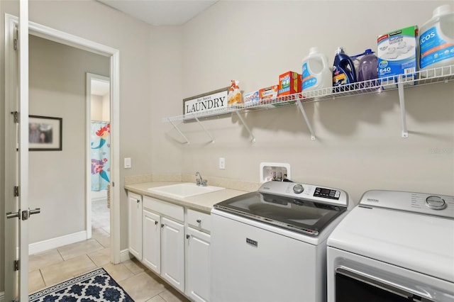 14715 Fishhawk Preserve Dr, Lithia, FL 33547 - washroom with washing machine and dryer, light tile patterned floors, cabinet space, and baseboards