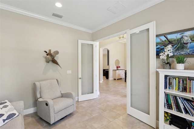 14715 Fishhawk Preserve Dr, Lithia, FL 33547 - living area featuring french doors, arched walkways, crown molding, baseboards, and recessed lighting