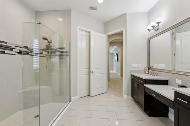 14715 Fishhawk Preserve Dr, Lithia, FL 33547 - bathroom with a stall shower, vanity, baseboards, and tile patterned floors