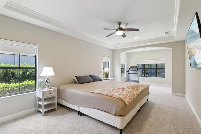 14715 Fishhawk Preserve Dr, Lithia, FL 33547 - carpeted bedroom with a tray ceiling, baseboards, ceiling fan, and crown molding