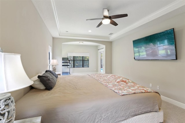 14715 Fishhawk Preserve Dr, Lithia, FL 33547 - carpeted bedroom featuring a raised ceiling, arched walkways, baseboards, a ceiling fan, and recessed lighting