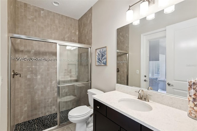 14715 Fishhawk Preserve Dr, Lithia, FL 33547 - full bathroom featuring toilet, vanity, a stall shower, and tile patterned floors