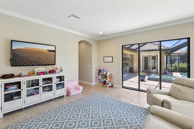 14715 Fishhawk Preserve Dr, Lithia, FL 33547 - living room with arched walkways, tile patterned flooring, ornamental molding, baseboards, and recessed lighting