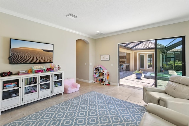 14715 Fishhawk Preserve Dr, Lithia, FL 33547 - tiled living area with arched walkways, crown molding, baseboards, and a textured ceiling