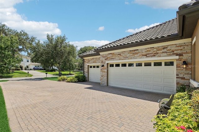 14715 Fishhawk Preserve Dr, Lithia, FL 33547 - garage featuring decorative driveway