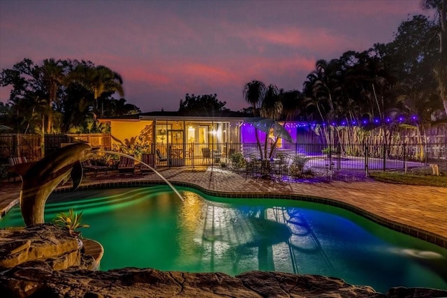 4301 S Lockwood Ridge Rd, Sarasota, FL 34231 - pool at dusk with a patio