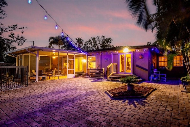 4301 S Lockwood Ridge Rd, Sarasota, FL 34231 - rear view of house featuring a sunroom