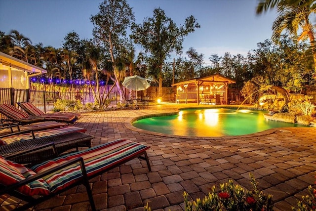 4301 S Lockwood Ridge Rd, Sarasota, FL 34231 - view of swimming pool featuring a patio, an outdoor structure, a fenced backyard, and a storage structure