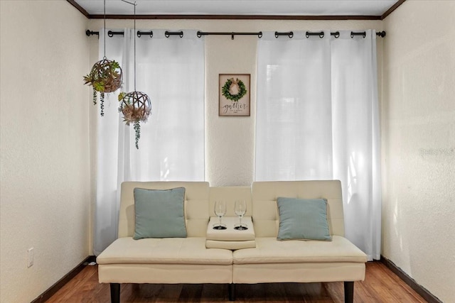 4301 S Lockwood Ridge Rd, Sarasota, FL 34231 - sitting room with wood finished floors, baseboards, and crown molding
