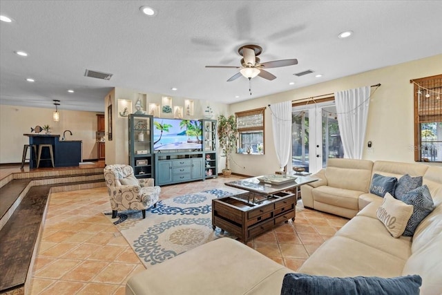 4301 S Lockwood Ridge Rd, Sarasota, FL 34231 - tiled living room featuring a ceiling fan and recessed lighting
