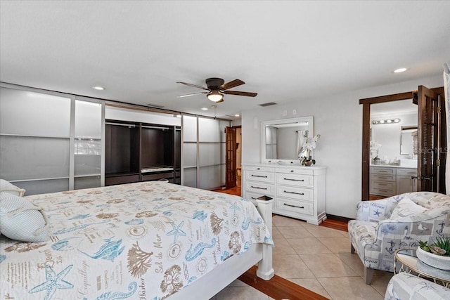 4301 S Lockwood Ridge Rd, Sarasota, FL 34231 - bedroom featuring light tile patterned floors, recessed lighting, and a ceiling fan