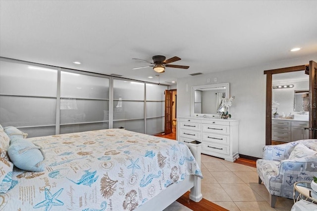 4301 S Lockwood Ridge Rd, Sarasota, FL 34231 - bedroom with light tile patterned floors, a ceiling fan, and recessed lighting