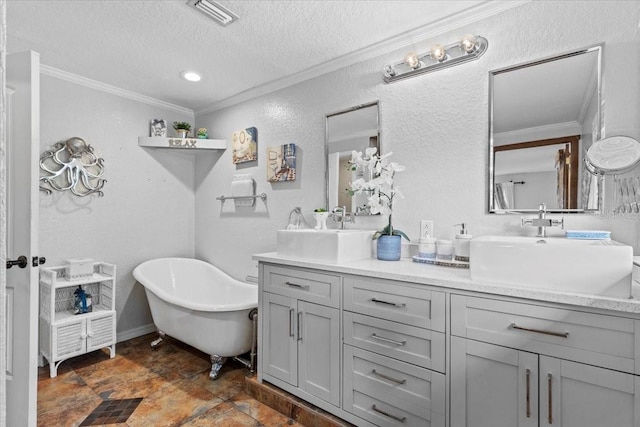 4301 S Lockwood Ridge Rd, Sarasota, FL 34231 - bathroom with double vanity, crown molding, a freestanding bath, a textured ceiling, and stone finish flooring