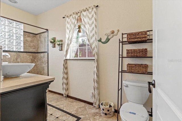 4301 S Lockwood Ridge Rd, Sarasota, FL 34231 - full bath with vanity, toilet, a shower, and tile patterned floors