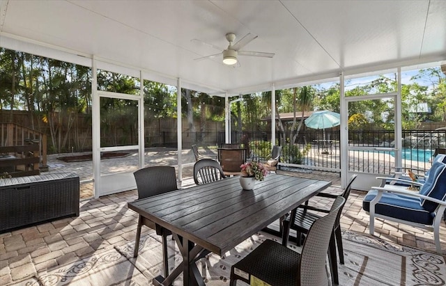 4301 S Lockwood Ridge Rd, Sarasota, FL 34231 - sunroom featuring ceiling fan and outdoor dining area