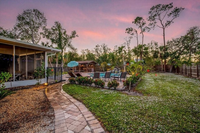 4301 S Lockwood Ridge Rd, Sarasota, FL 34231 - view of yard with a sunroom and a patio area