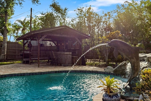 4301 S Lockwood Ridge Rd, Sarasota, FL 34231 - view of pool with a gazebo, a fenced backyard, a water slide, and a patio area