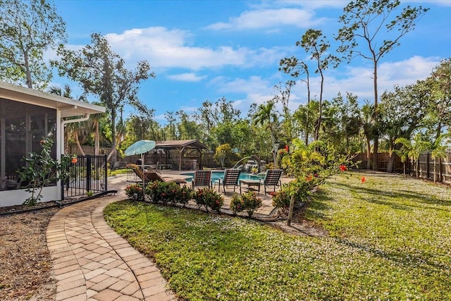 4301 S Lockwood Ridge Rd, Sarasota, FL 34231 - view of yard featuring a gazebo, a sunroom, and a patio area