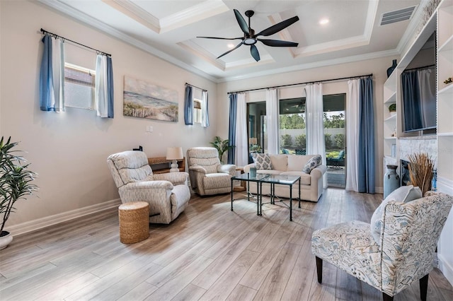 4620 Ballast Crest Cv, Land O Lakes, FL 34638 - living area featuring healthy amount of natural light, coffered ceiling, ceiling fan, light wood-style flooring, and crown molding