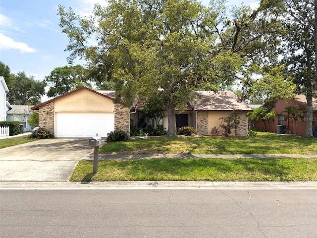 1228 Rainbrook Cir, Valrico, FL 33596 - view of front of property with an attached garage, a front yard, concrete driveway, and brick siding