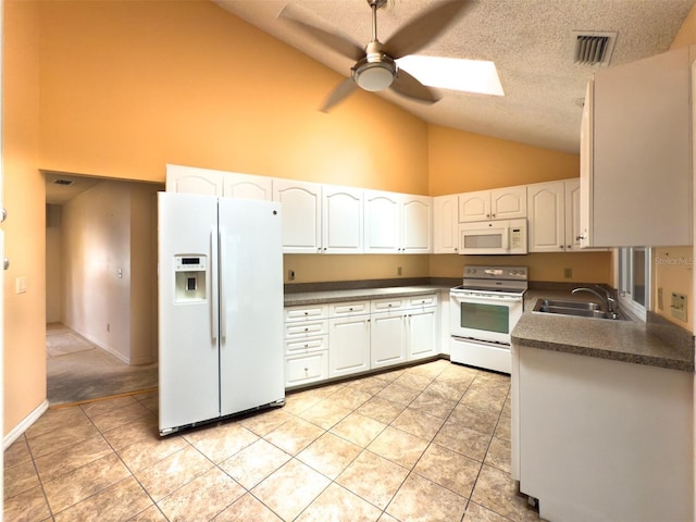 1228 Rainbrook Cir, Valrico, FL 33596 - kitchen with white appliances, dark countertops, high vaulted ceiling, ceiling fan, and a sink
