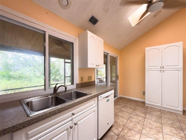 1228 Rainbrook Cir, Valrico, FL 33596 - kitchen with white dishwasher, a sink, ceiling fan, dark countertops, and lofted ceiling