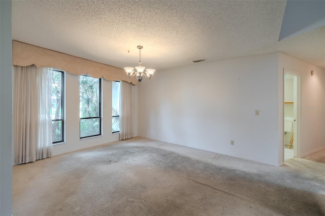 1228 Rainbrook Cir, Valrico, FL 33596 - unfurnished room with a chandelier, light colored carpet, and a textured ceiling