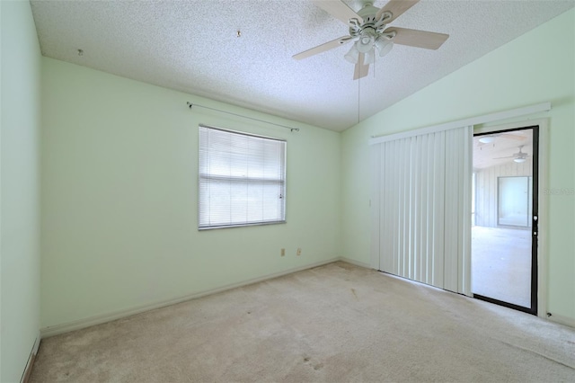 1228 Rainbrook Cir, Valrico, FL 33596 - spare room featuring carpet flooring, vaulted ceiling, a ceiling fan, a textured ceiling, and baseboards