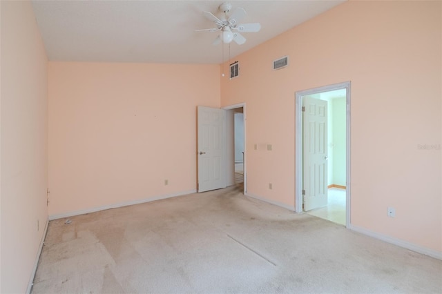 1228 Rainbrook Cir, Valrico, FL 33596 - empty room with light colored carpet, ceiling fan, baseboards, and high vaulted ceiling