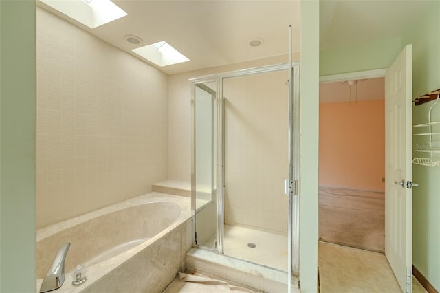 1228 Rainbrook Cir, Valrico, FL 33596 - full bathroom with a skylight, a bath, and a stall shower