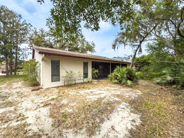 1228 Rainbrook Cir, Valrico, FL 33596 - view of front of house featuring a sunroom and stucco siding