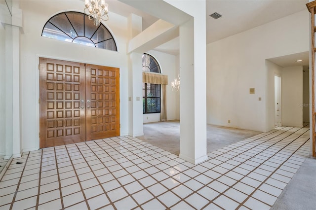707 Warren Rd, Lutz, FL 33548 - entrance foyer with a chandelier and carpet