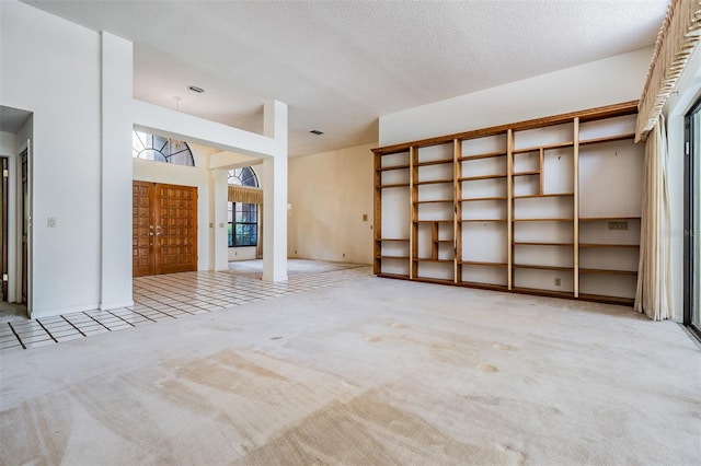 707 Warren Rd, Lutz, FL 33548 - unfurnished living room featuring carpet flooring and a textured ceiling