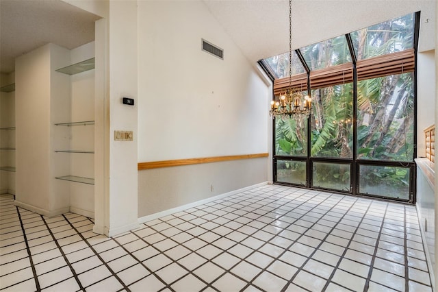 707 Warren Rd, Lutz, FL 33548 - unfurnished dining area featuring a chandelier, tile patterned floors, a textured ceiling, a skylight, and baseboards