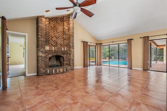 707 Warren Rd, Lutz, FL 33548 - unfurnished living room with high vaulted ceiling, light tile patterned floors, a ceiling fan, a fireplace, and baseboards