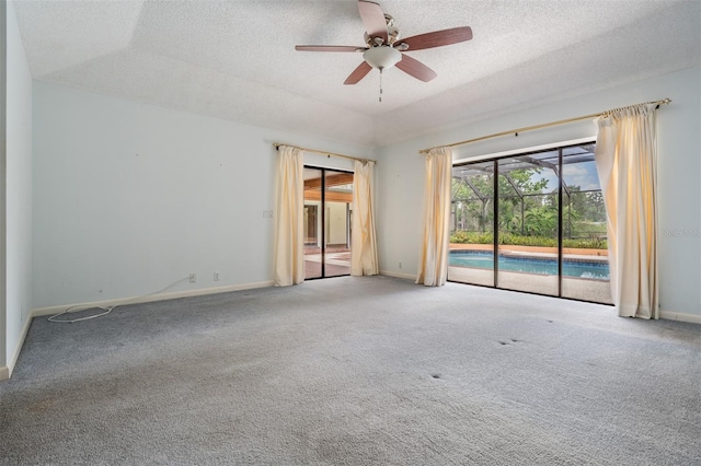 707 Warren Rd, Lutz, FL 33548 - carpeted spare room featuring ceiling fan, a textured ceiling, and baseboards