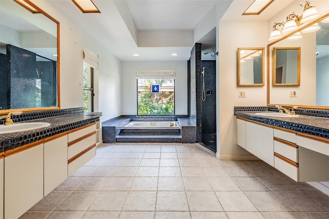 707 Warren Rd, Lutz, FL 33548 - full bath featuring a bath, two vanities, a stall shower, tile patterned flooring, and recessed lighting