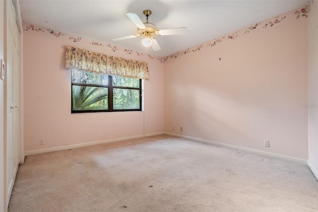 707 Warren Rd, Lutz, FL 33548 - spare room with light carpet, baseboards, and ceiling fan